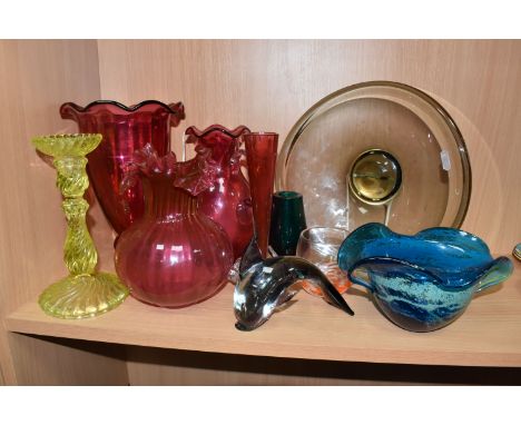 A GROUP OF ASSORTED DECORATIVE GLASS to include four pieces of cranberry glass comprising three vases and a jug of differing 
