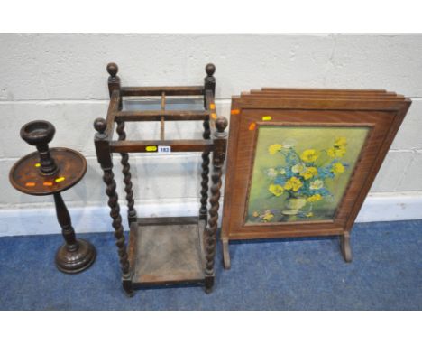 A 20TH CENTURY OAK UMBRELLA / STICK STAND, with barley twist supports, 33cm squared x height 76cm, a fire screen, and a candl