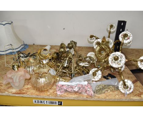 A GROUP OF LIGHT FITTINGS AND GLASS SHADES, comprising a set of two five armed gilt metal chandeliers with floral ceramic fit