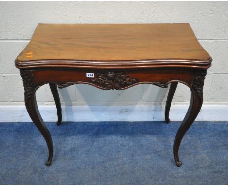 A 20TH CENTURY FOLD OVER CARD TABLE, fitted with a green baize playing surface, the wavy apron and cabriole legs with foliate
