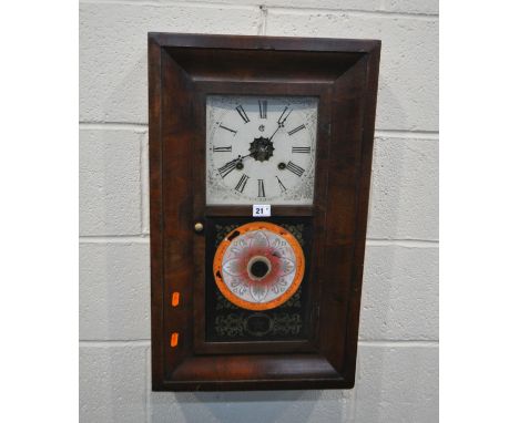 WATERBURY CLOCK CO, AN EARLY 20TH CENTURY MAHOGANY WALL CLOCK, the single door with scrolled and foliate patterns, that’s enc