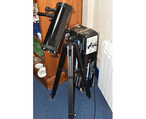 A BOXED TASCO TELESCOPE, model 302911, D = 4.5'' F=500mm, made in Japan, on an adjustable tripod, box contains a Philips' Pla