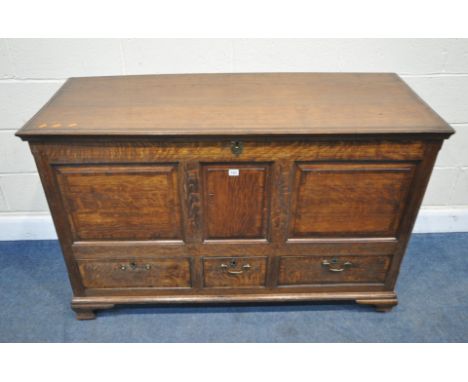 A GEORGIAN OAK COFFER, with a hinged lid, and three sized drawers, width 136cm x depth 56cm x height 87cm, condition report: 
