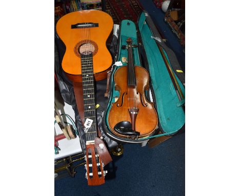 A TATRA GUITAR AND AN UNMARKED VIOLIN comprising a Tatra acoustic guitar with a leather shoulder strap, length approximately 