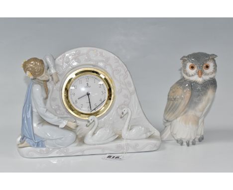 A LLADRO MANTEL CLOCK AND A NAO OWL comprising a ceramic Lladro clock No. 5777 with figures of a female and two swans, fitted