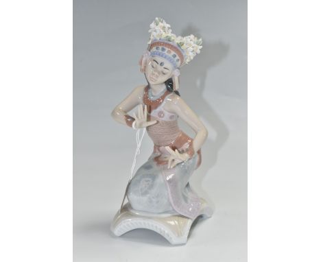 A LLADRO FIGURINE 'BALI DANCER POSE' no. 6142, sculptor Francisco Polope, issued 1994, retired 1997, glaze finish, height 23c