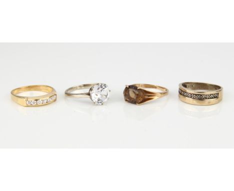 Four 9ct gold stone-set rings - comprising a yellow gold and diamond half eternity ring, unmarked, tests as 9ct gold, with tw