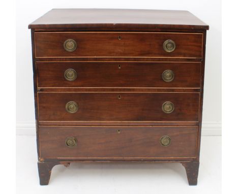 A mid-19th century mahogany straight-front chest - the four long, graduated drawers with later ring-handles, on bracket feet.