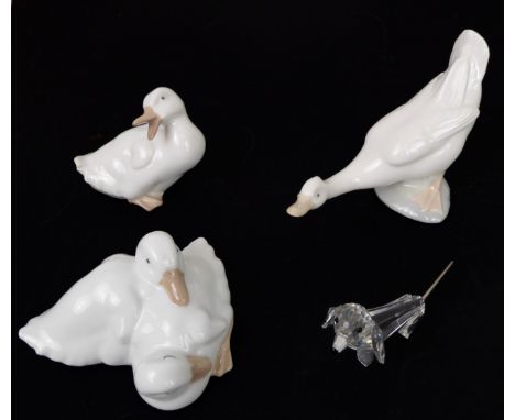 Three Nao porcelain figures of ducks and geese - together with a Swarovski dachshund. (4)