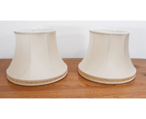 A pair of ivory silk lamp shades - with pale-gold pleated silk lower borders, 40.5 cm in diameter, 30 cm. high.