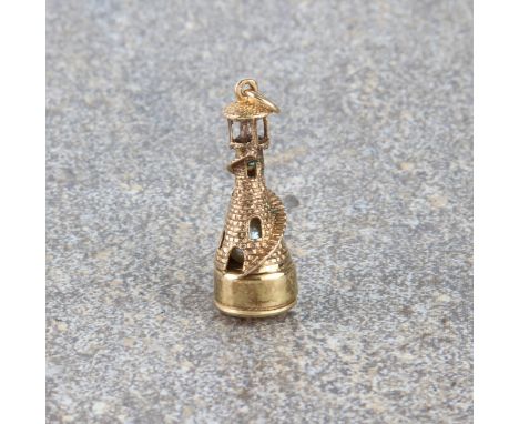 A 9ct gold lighthouse bracelet charm - hallmarked London 1984, 3.2 cm high plus suspension ring, gross weight 5.6g.