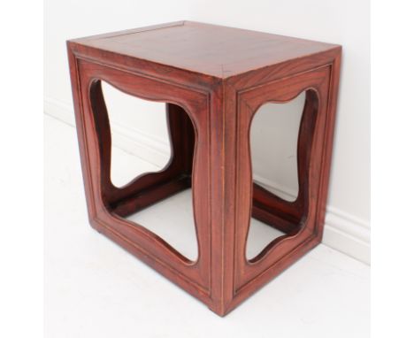 An Oriental stained elm or cedar lamp-table - mid-20th century, of box form, with cleated top and cut-out panelled sides. (LW