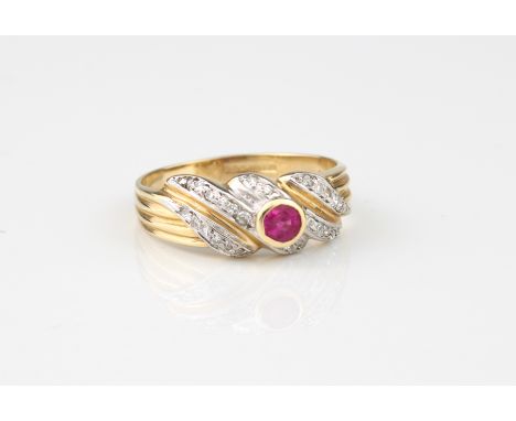 A 14ct yellow gold, ruby and diamond ring - hallmarked Sheffield 2000, the central round cut ruby in a twist setting with fou