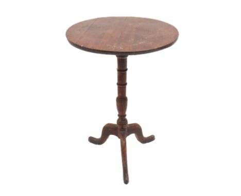 Three pieces: 1. an early 19th century mahogany tripod table - the circular top on a turned column to three swept supports wi