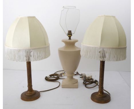 A pair of brass candlestick style table lamps - with spiral reeded columns and bases, with tasseled silk shades, 51cm. high o