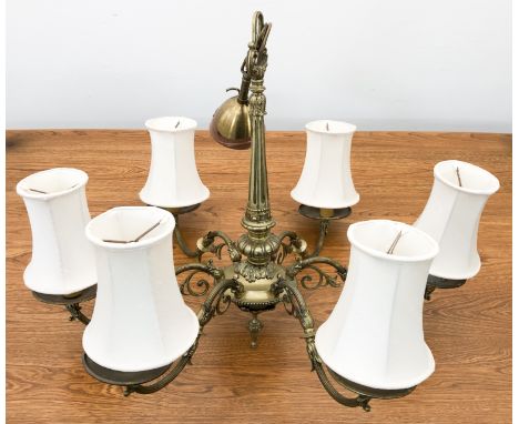A six-light brass chandelier or ceiling light fitting - with six reeded, foliate scroll arms issuing from a fluted, foliate a