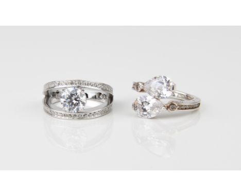 A boxed Swarovski ring - ref. 5032919, with tag, size P&frac12;; together with a silver twist ring set with clear stones by T