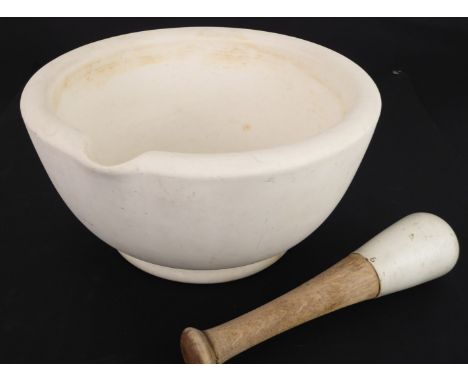 A large and heavy ceramic pestle and&nbsp;mortar - stamped 'Warranted Acid Proof' to base, with pouring spout to rim, 28cm. d