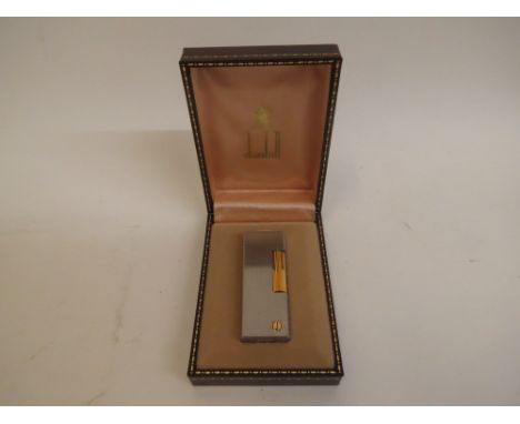 Dunhill - a 1980s stainless steel and gold plated Rollagas lighter in a brown faux hide case