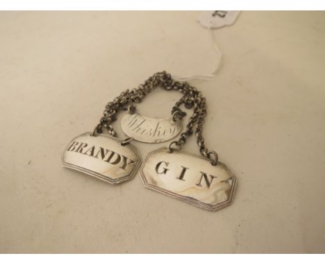 Three early 20th century silver decanter labels, 21.6 grams