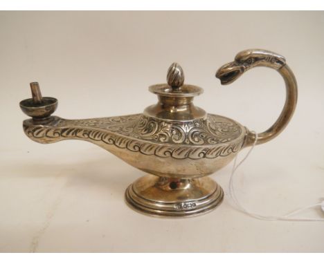 An Edward VII silver Roman design oil lamp lighter by Levesley Brothers Sheffield 1902, with embossed and chased scrolled dec