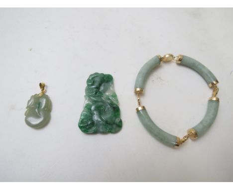 A 14k yellow gold and jade bracelet, a 18k yellow gold and green jade pendant in the form of  lychee fruit, and a mottled gre