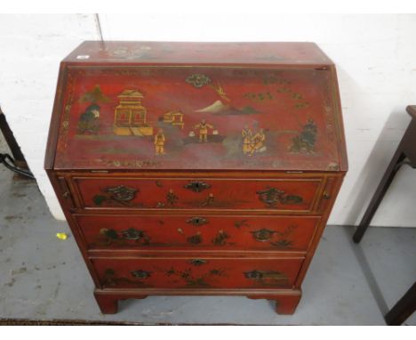 An early 18th century red lacquered bureau with floral and scenic chinoiserie decoration in gilt and green, with a fall front