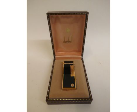 Dunhill - a 1980s gold plated and enamelled Rollagas lighter with black panels in a brown faux leather case