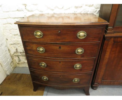 A George III mahogany bow front chest with a crossbanded top over four graduated long drawers on bracket feet, 38 high , 31 1