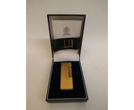 Dunhill - a 1980s gold plated Rollagas lighter with engine turned decoration in a blue faux hide case