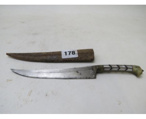 An early 20th century Middle Eastern dagger having a mother of pearl and green onyx handle, 9 long