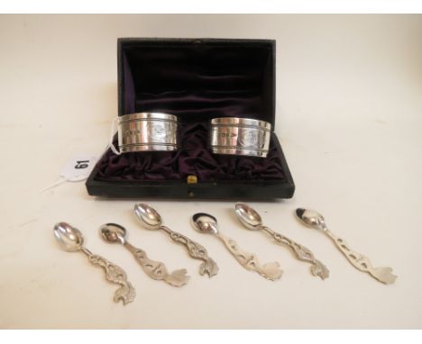 A pair of late Victorian silver napkin rings, Walker and Hall Sheffield 1898, with engraved bands and cartouches, one with th