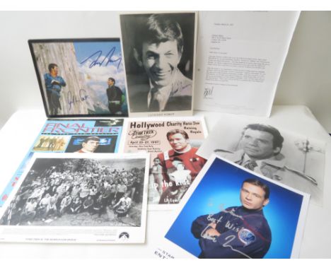 A selection of Star Trek memorabilia to include studio photographs, one signed by and depicting Leonard Nimoy, another depict