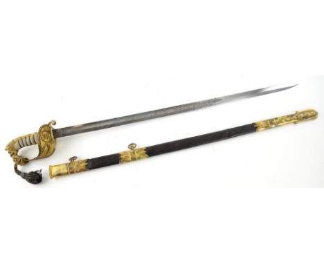 19th century Naval Officer's sword. The 1827 pattern sword , has a pommel lion's head half-basket hilt and is of gilded brass