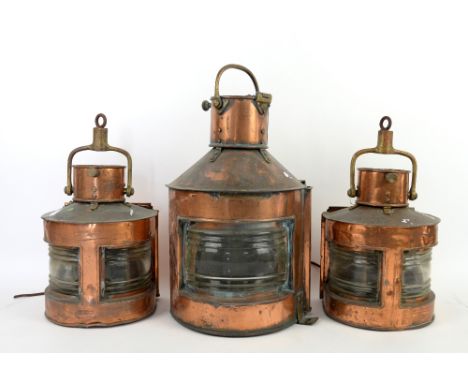 Pair of copper ships lamps and another larger,.    All with various dents and losses, all have been converted to electricity,