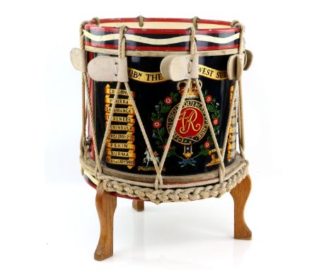 Mid 20th century painted Military drum for the The Royal West Surrey Regiment, on stand, diameter 40cm by Potters. This drum 