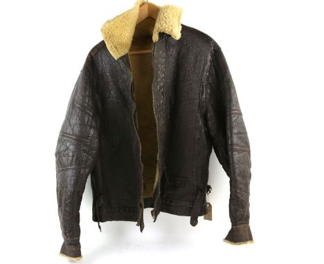 20th century sheepskin flying jacket with four panel back broad Arrow mark to zip pull.    