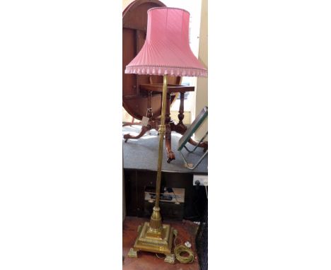 Brass adjustable standard lamp with complete with pink shade Condition report: see terms and conditions
