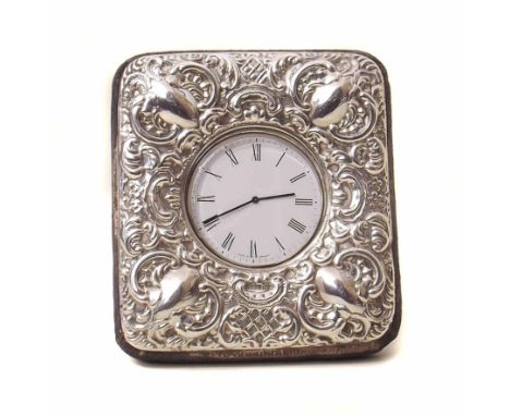 Bed side clock (Quartz) in repousse silver frame.Condition report: All clocks and watches are sold without warranty. Comments