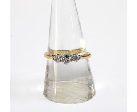 18ct gold three stone diamond ring, stamped 18ct