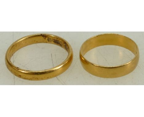Two 22ct gold wedding rings: sizes J and M, 6.1 grams. (2)