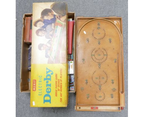 A mixed collection of items to include: Chad Valley branded bagatelle game, Merit branded boxed Electric Derby Game, MB trave