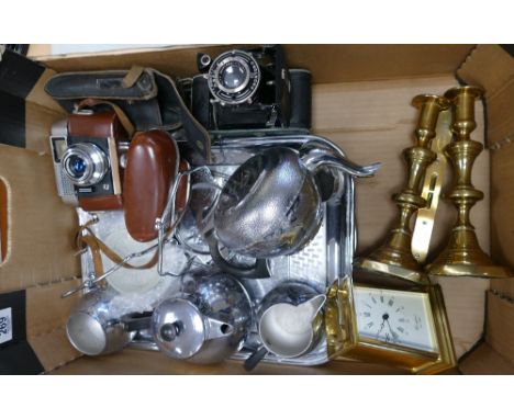 A mixed collection of items to include: Heavy Woodford branded Quartz carriage clock, brass candlesticks, chromed tea ware, 3