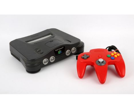Nintendo 64 Black Console & Red Controller plus Memory Expansion. This lot contains the original Nintendo 64 console complete