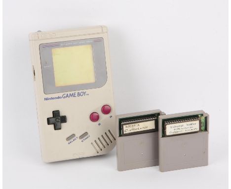 Nintendo Game Boy & Development Games. This lot contains a fully working and tested original grey Nintendo Game Boy. This ite