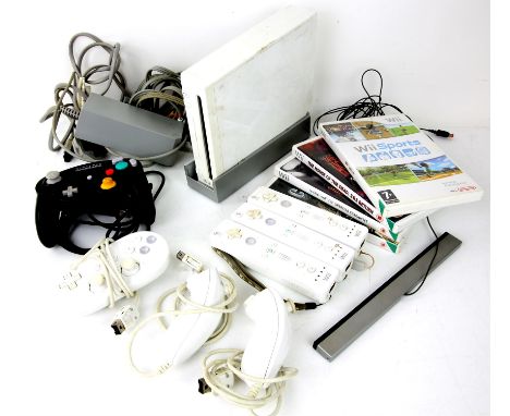 Nintendo Wii console Bundle. This lot contains an unboxed Nintendo Wii console, 3 remote controllers, 2 nun-chuck controllers