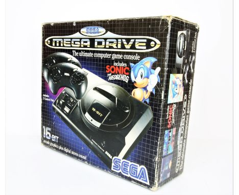 Sega Mega Drive Console - Sonic 1 Boxed Edition. The item comes in the original box and includes two official controllers alo