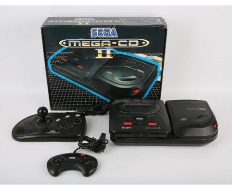 Sega Mega Drive 2 & Mega-CD 2 Console This lot contains a Sega Mega Drive 2 and Mega-CD 2 inside the original box for the Seg
