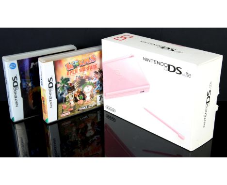 Nintendo DS Lite Pink - Complete in Box & Games. This item contains a complete in box Nintendo DS lite, fully working and wit
