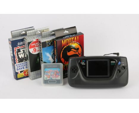 Sega Game Gear - Power Pack + 5 Games. This lot contains a Sega Game Gear, Gamester power grip and power pack and 5 games. It